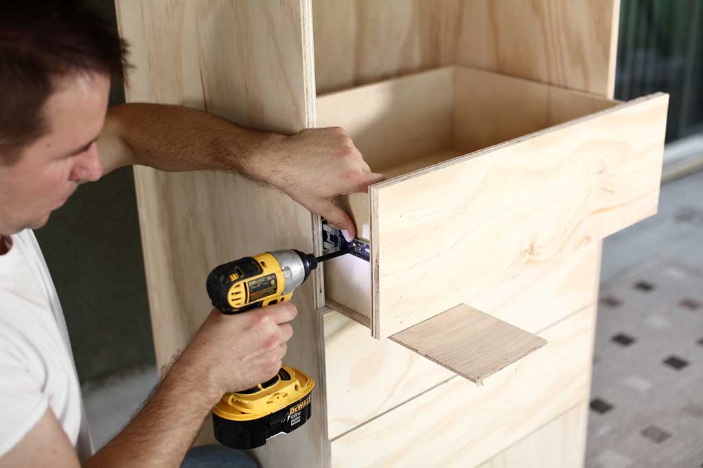 attaching drawers to the DIY closet organizer