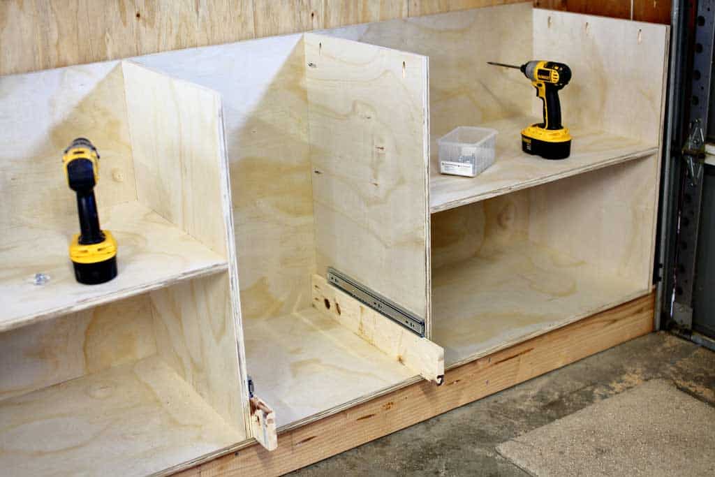 install the bottom slide of the DIY Garage Cabinets