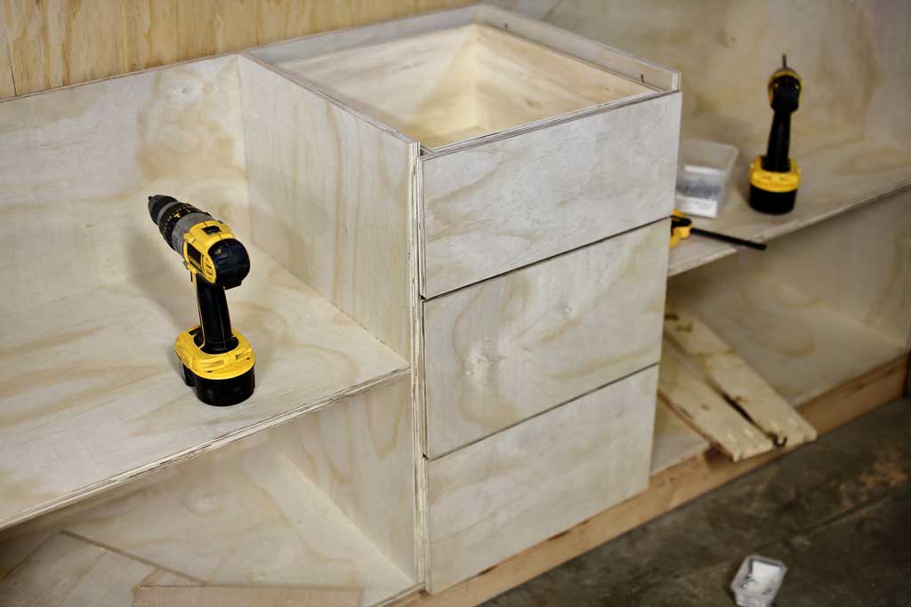 installing the drawers for the DIY Garage Cabinets