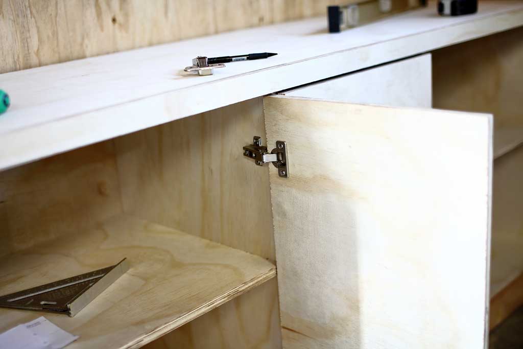 attaching the door to the DIY Garage Cabinets