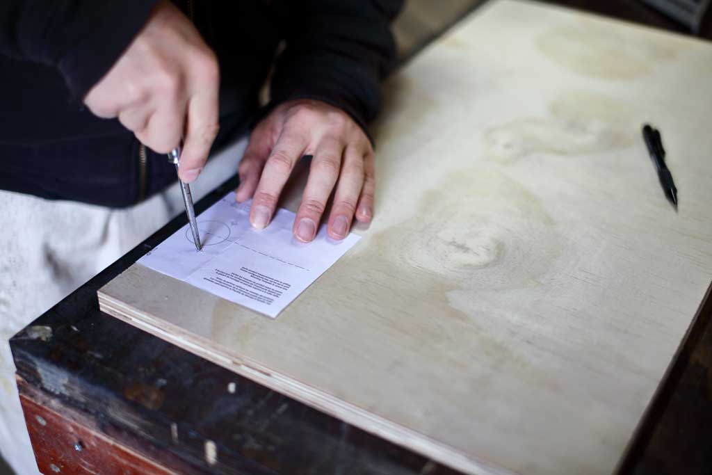 using a cabinet hinge template to mark on the door