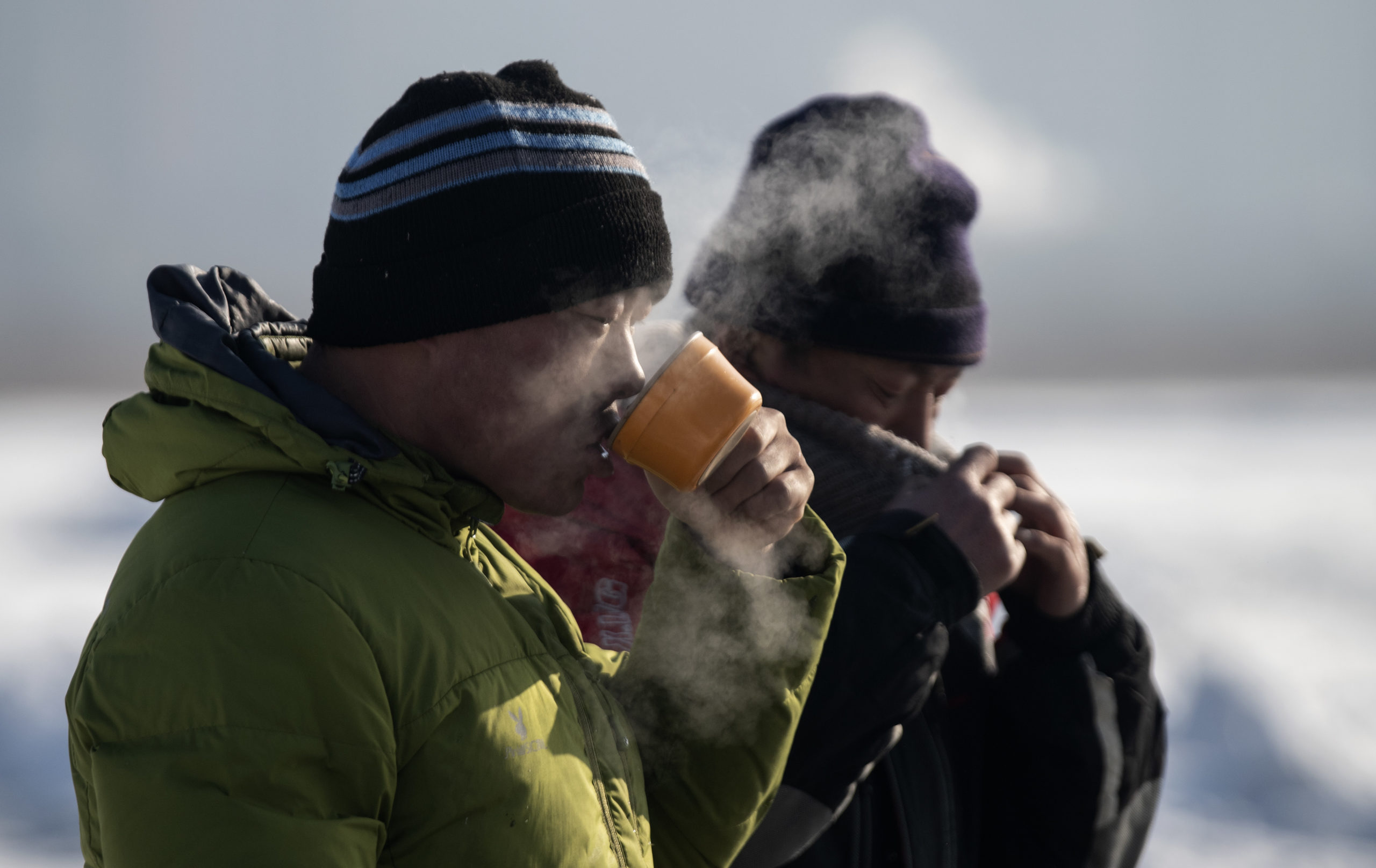 man drinking hot tea