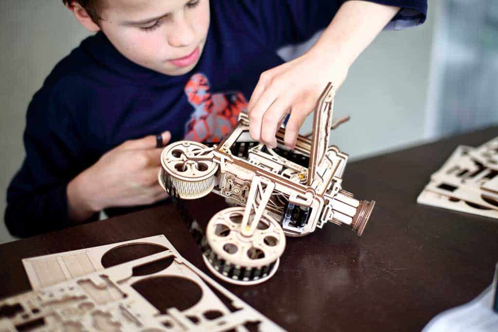 Boy building 3D puzzle