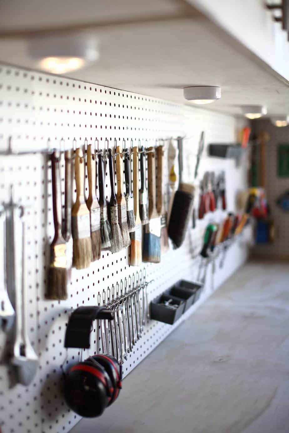 brushes hanging on the pegboard