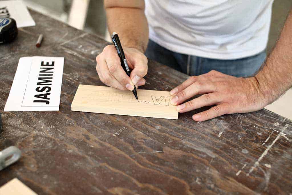 writing names on the board for carving