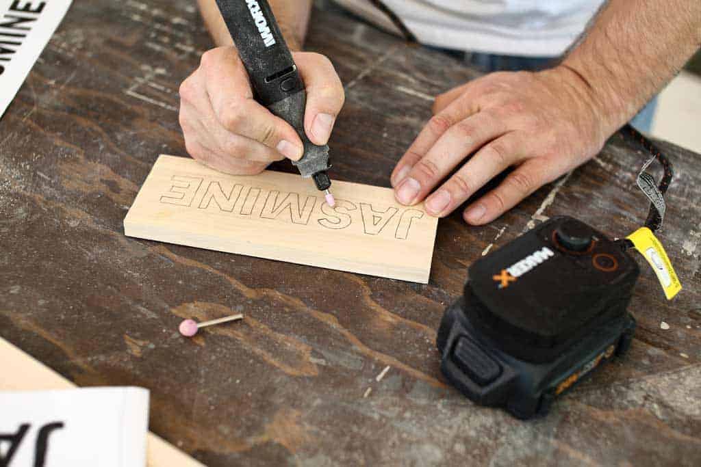 using makerx worx to carve letters on wood