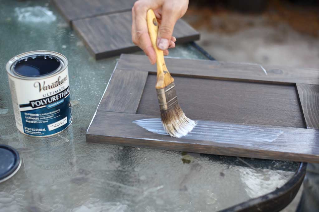 applying polyurethane on cabinet door