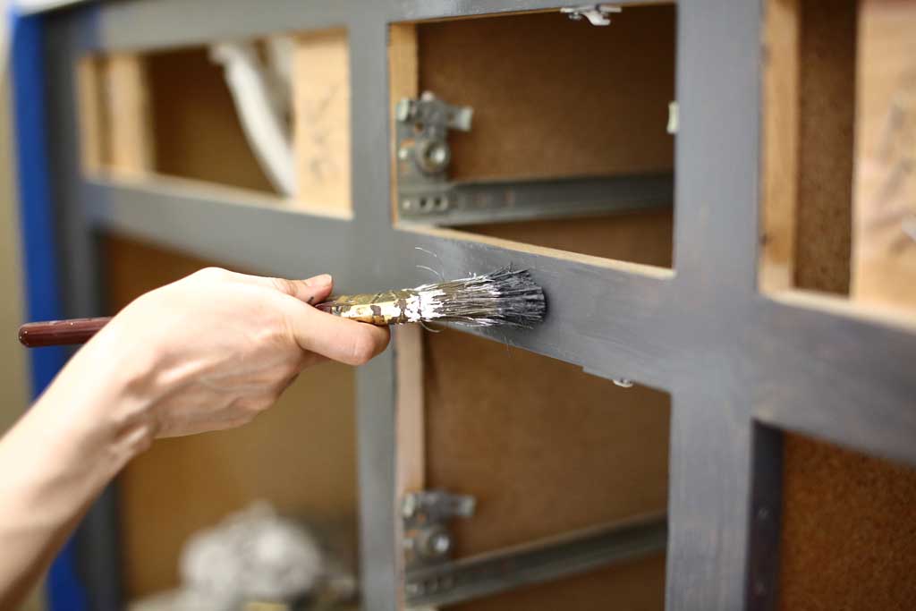 painting cabinet frame with brush