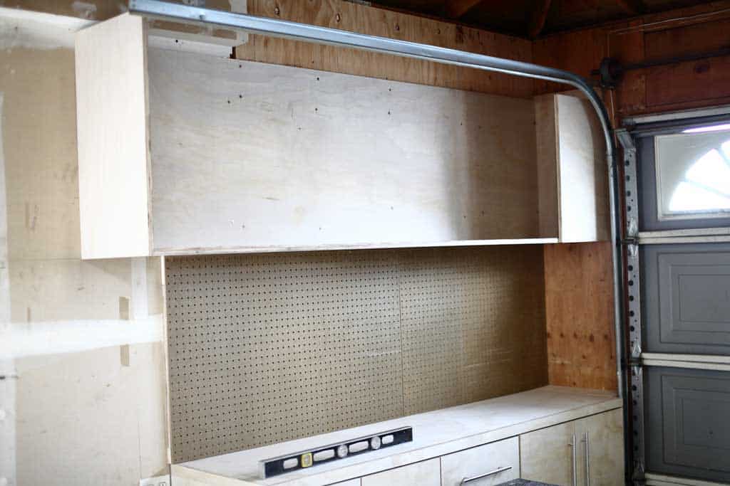 garage cabinets frame is attached to the wall