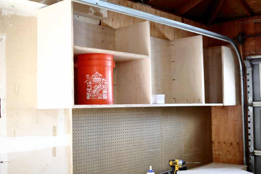 attaching dividers on the garage cabinets