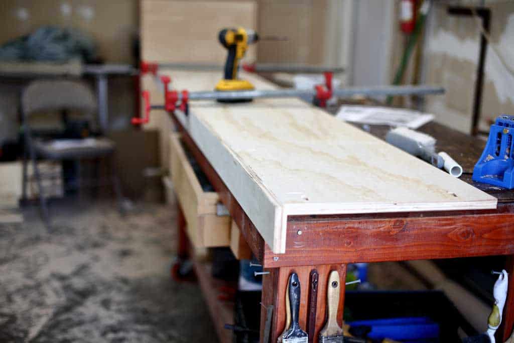 assembling the top piece together for the attaching the top piece of the garage cabinets