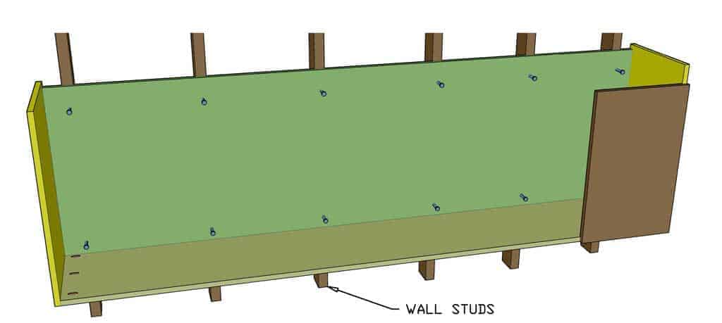 attaching the garage cabinet to the wall studs