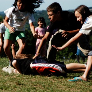 Kids playing tag while camping