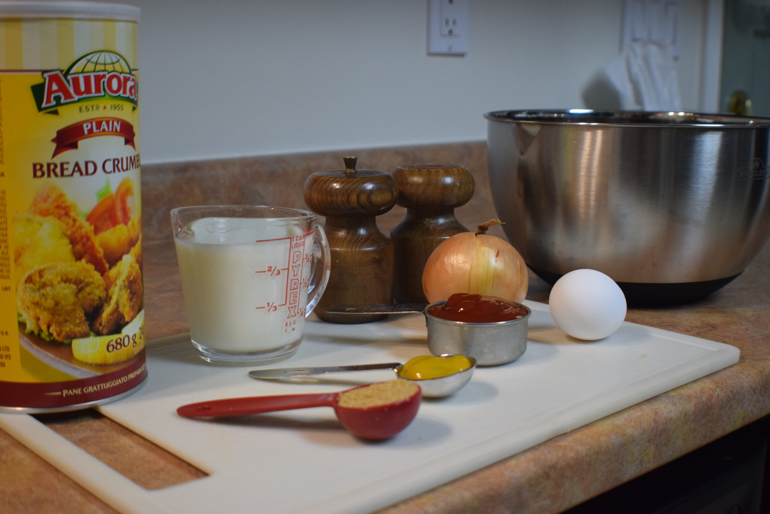 meatloaf ingredients on white cutting board