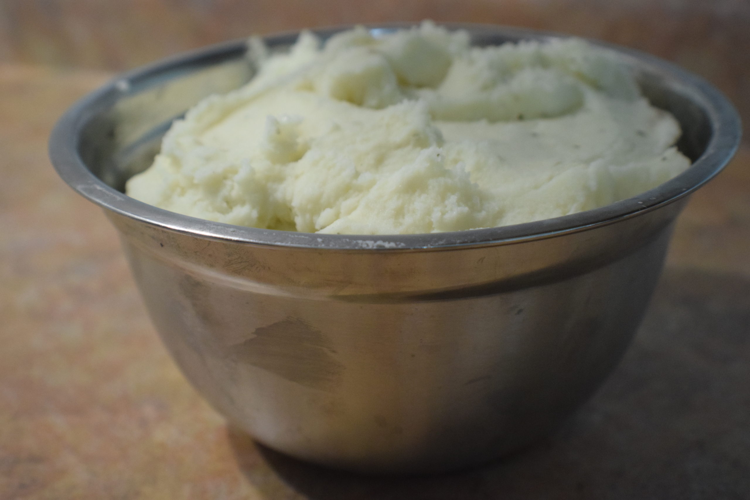 mashed potatoes in metal bowl