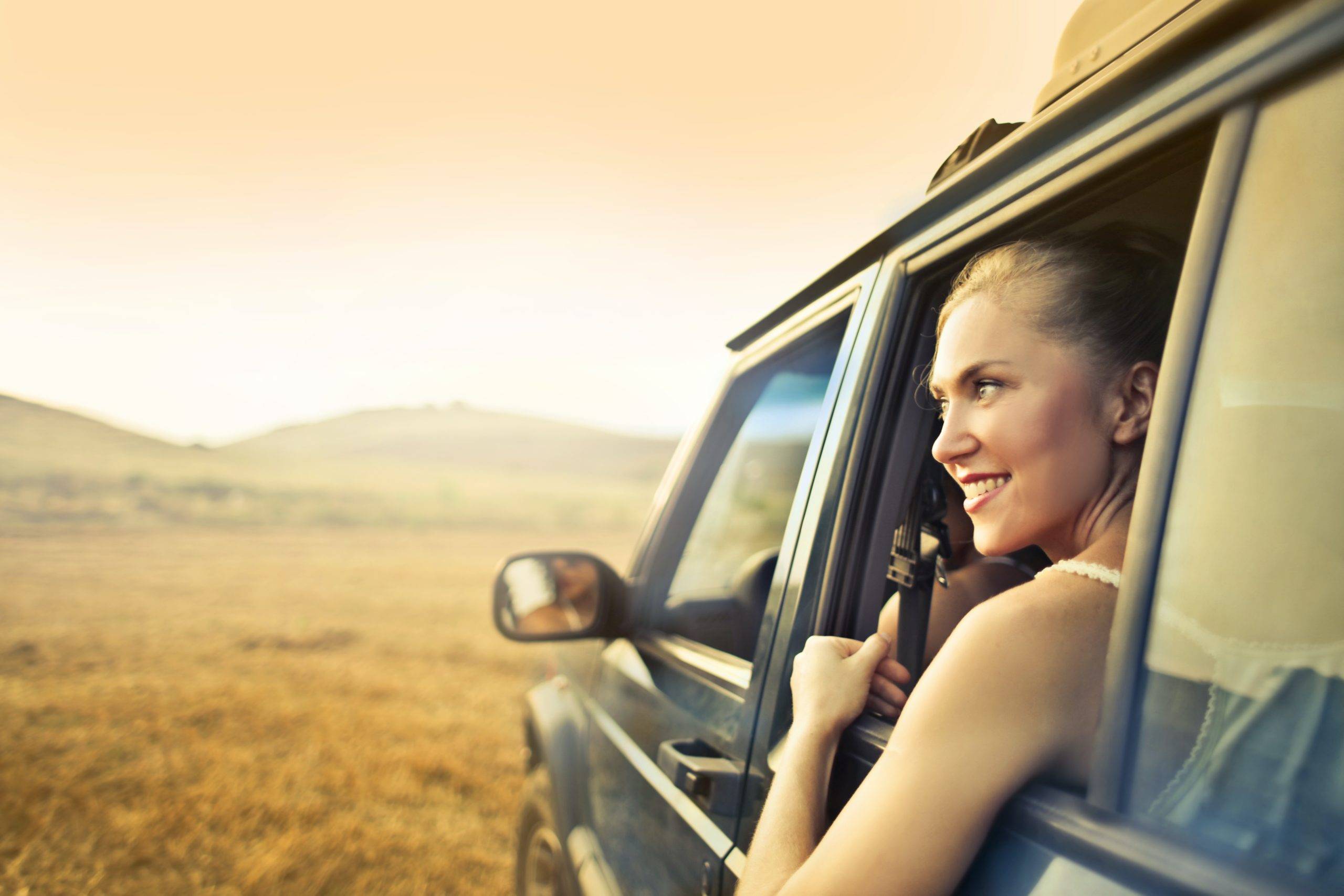 Woman staring out the window of a car