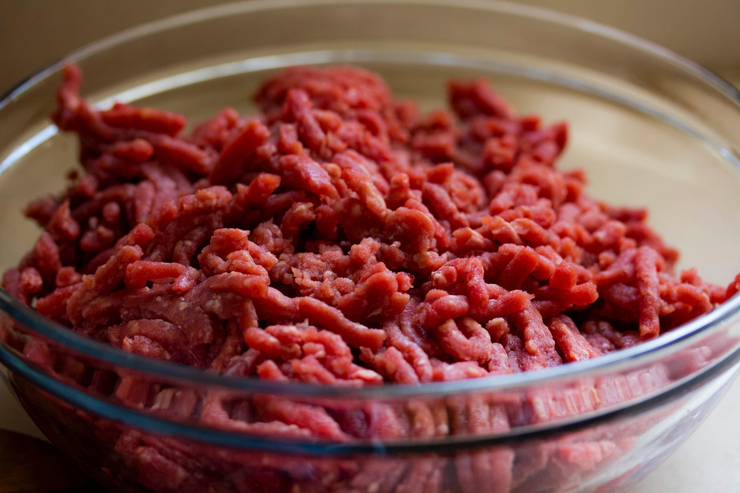 raw ground beef in glass bowl