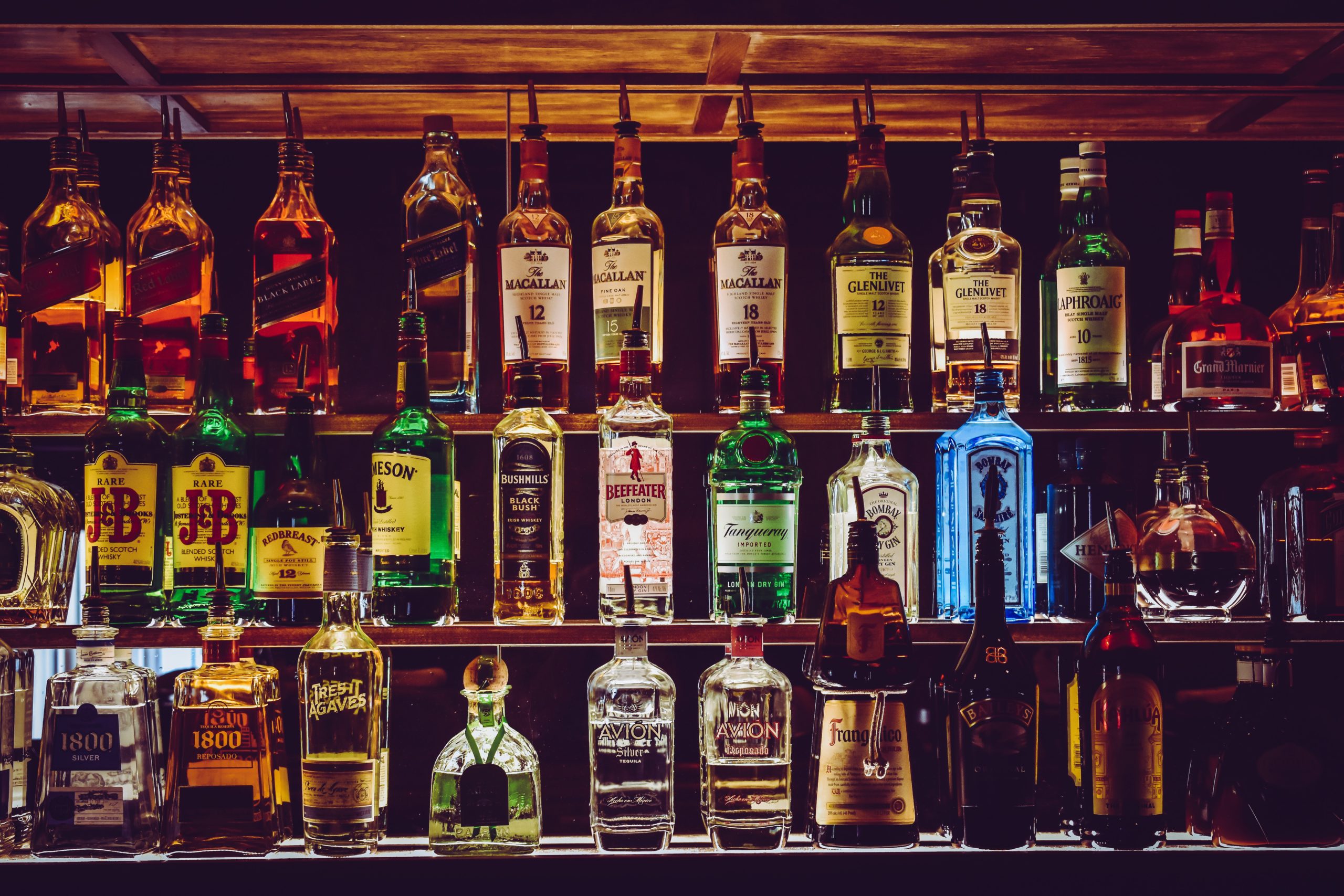 shelves with liquor in a dark bar