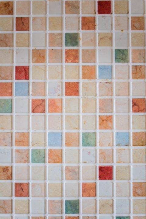 pastel tile backsplash with white grout