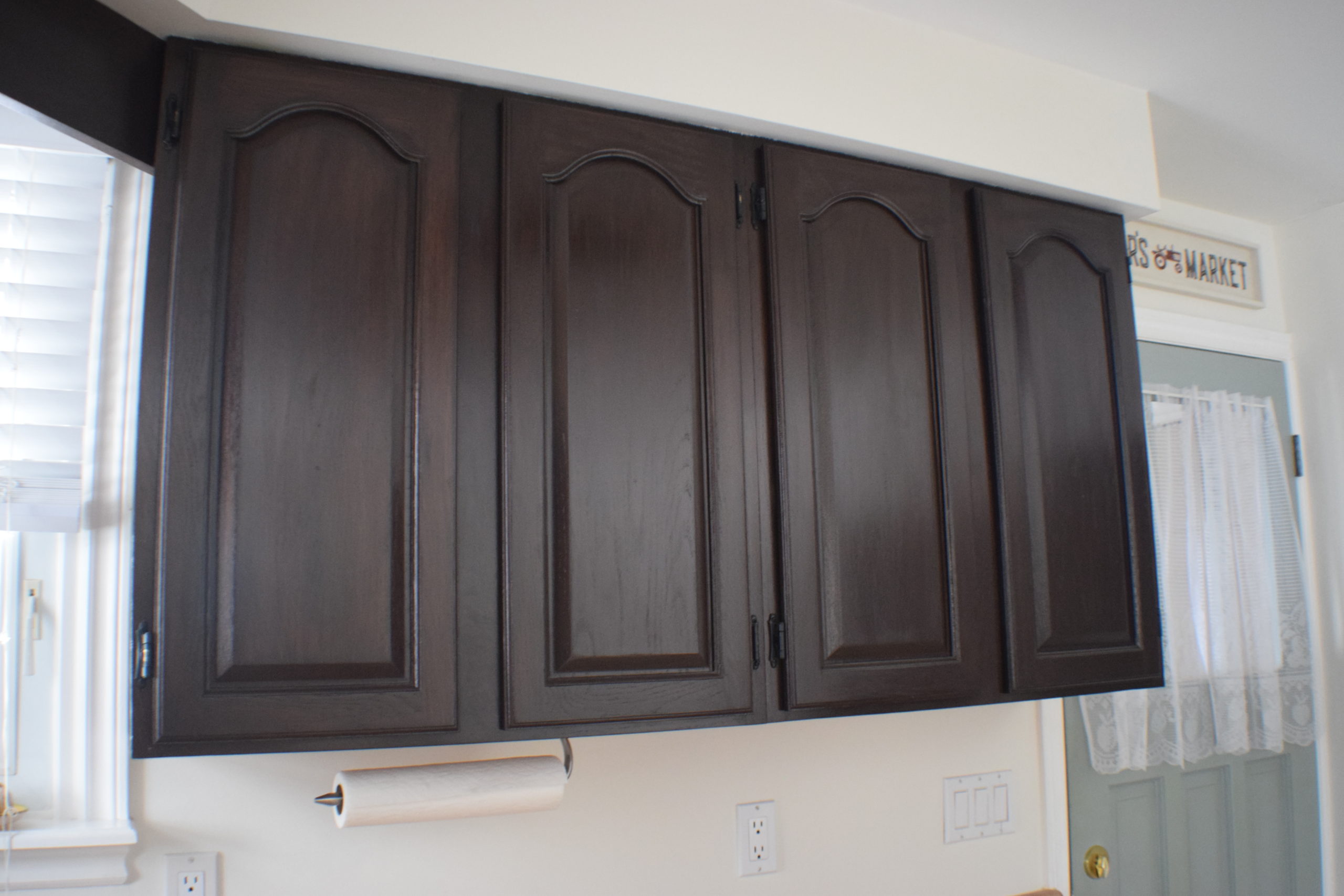 for of upper kitchen cabinets in dark stain without handles