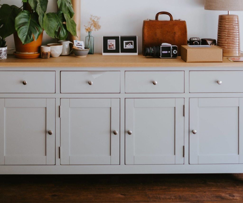 light blue cabinet with gold hardware