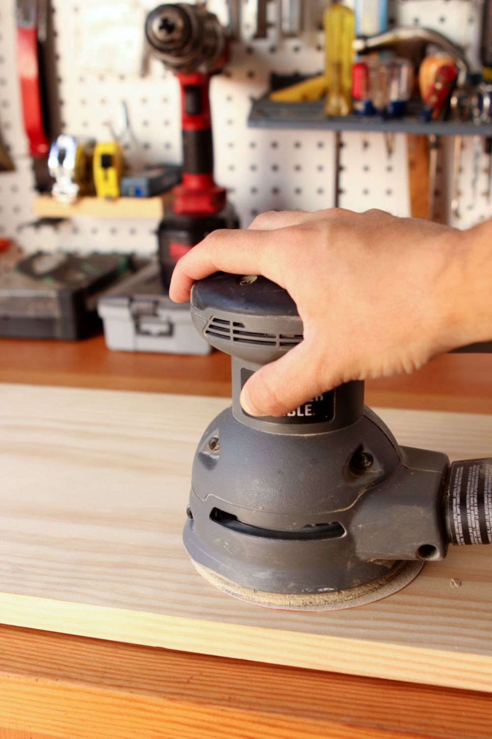 smoothing wood with the random orbit sander