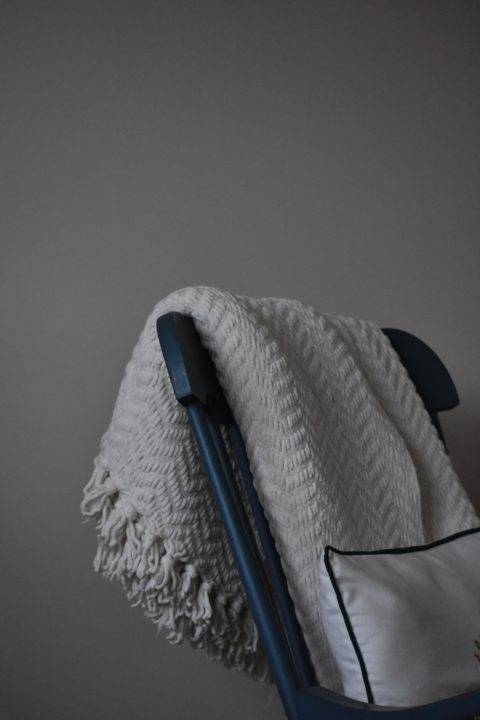 blanket draped over a chair