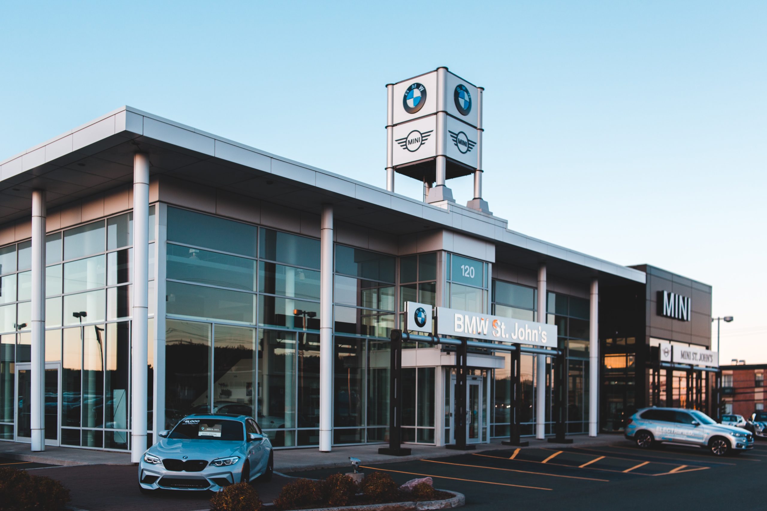 brand new car dealership with cars in the lot