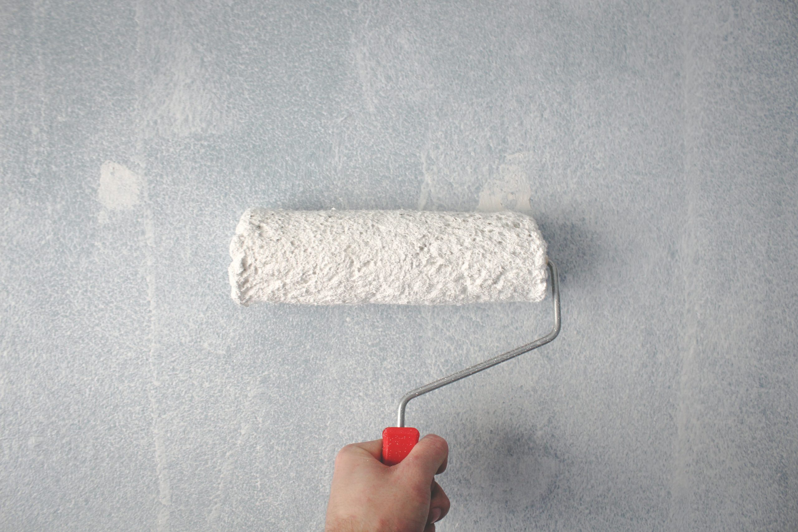 paint roller covering hole in wall