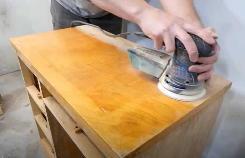 How to Paint Wood Furniture Like a Pro, Step-By-Step - orbital sander