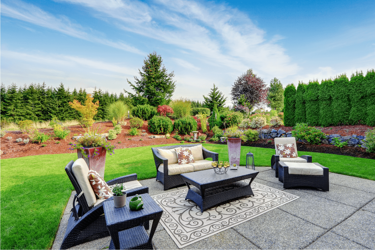 outdoor deck with patio furniture and rug