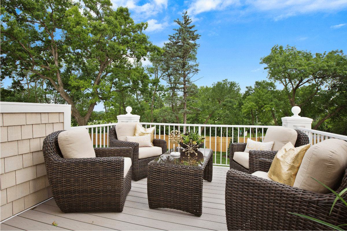 comfortable white patio wicker plastic furniture on deck