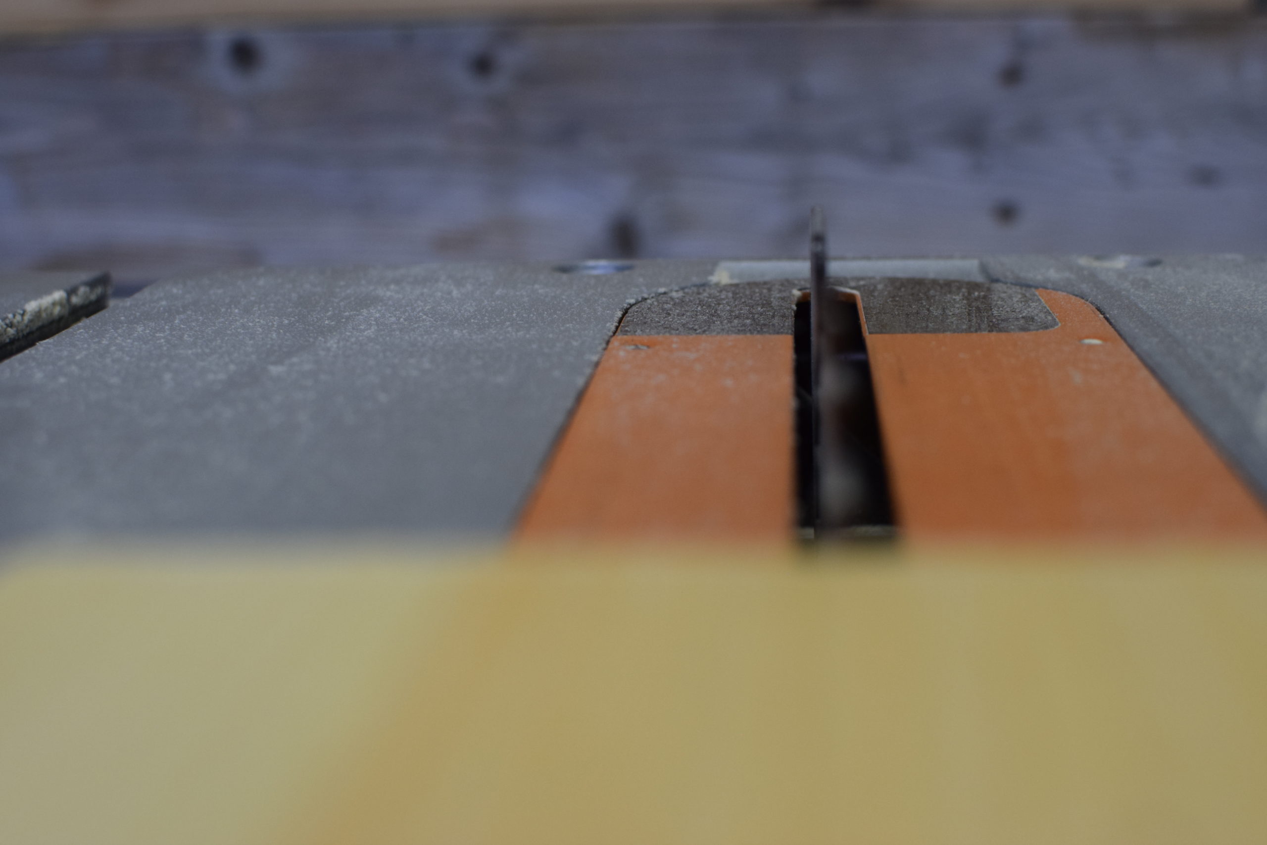 table saw blade in action ready to cut wood