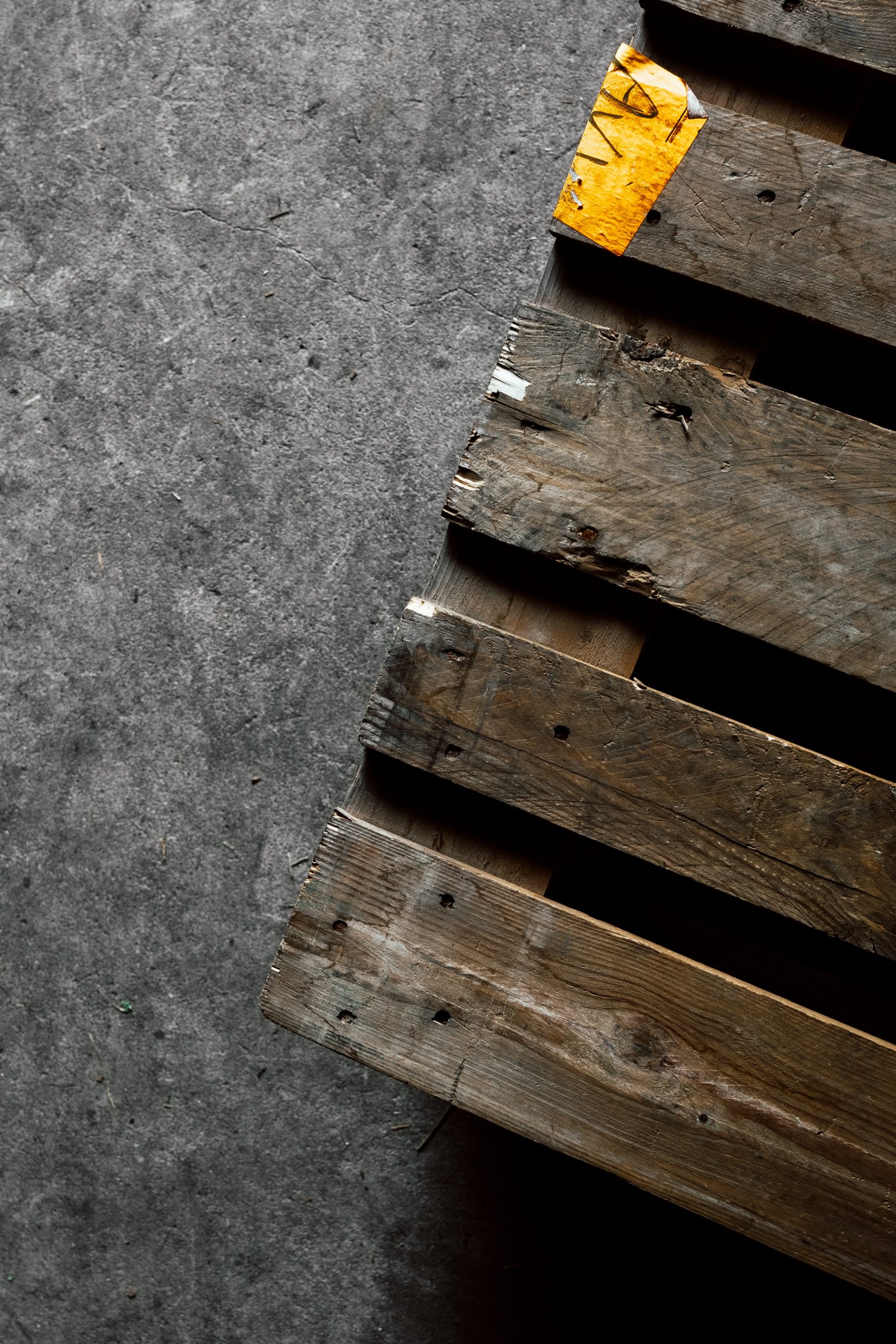 old wooden pallet on cement floor