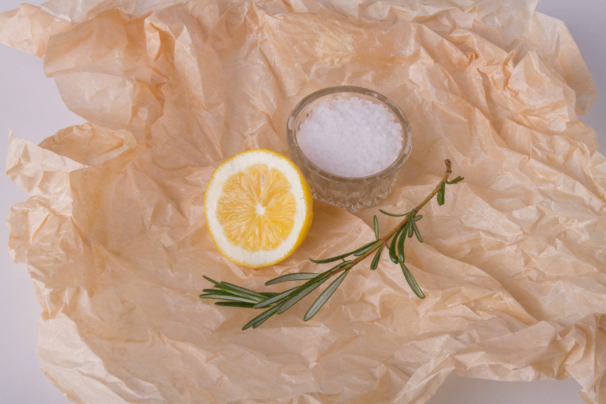 Rosemary, lemon and salt on kraft paper