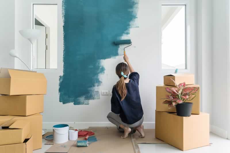 woman painting home