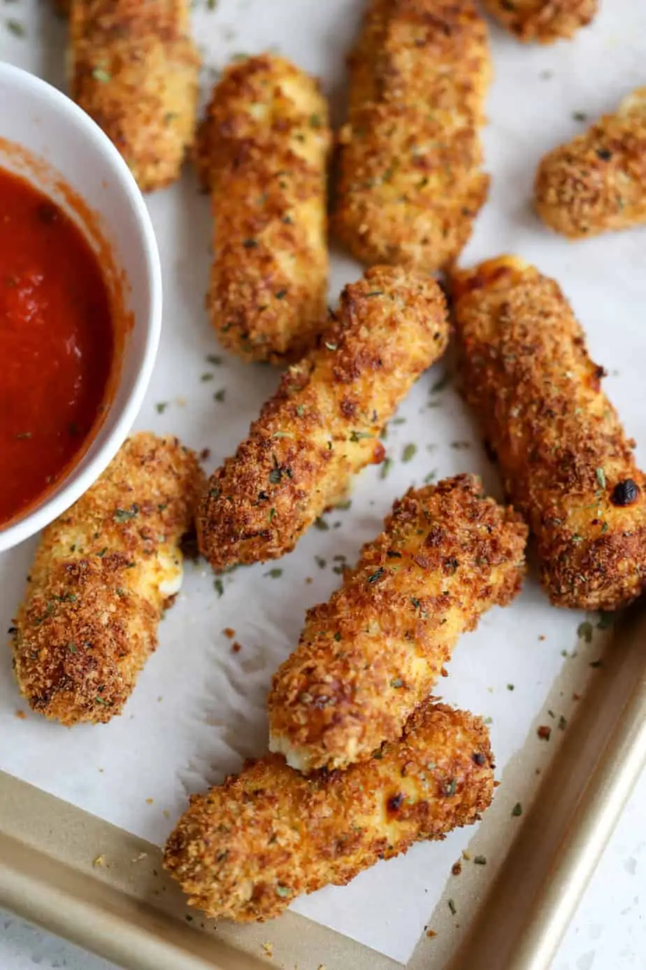 crispy fried mozza sticks on tray with dipping sauce