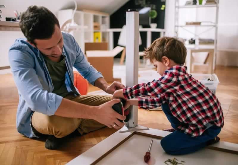 father and son doing DIY project