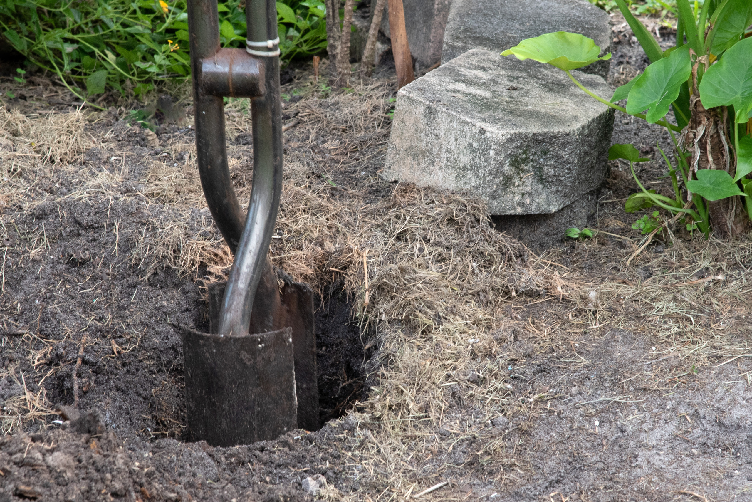 Manual post hole digger made of steel.