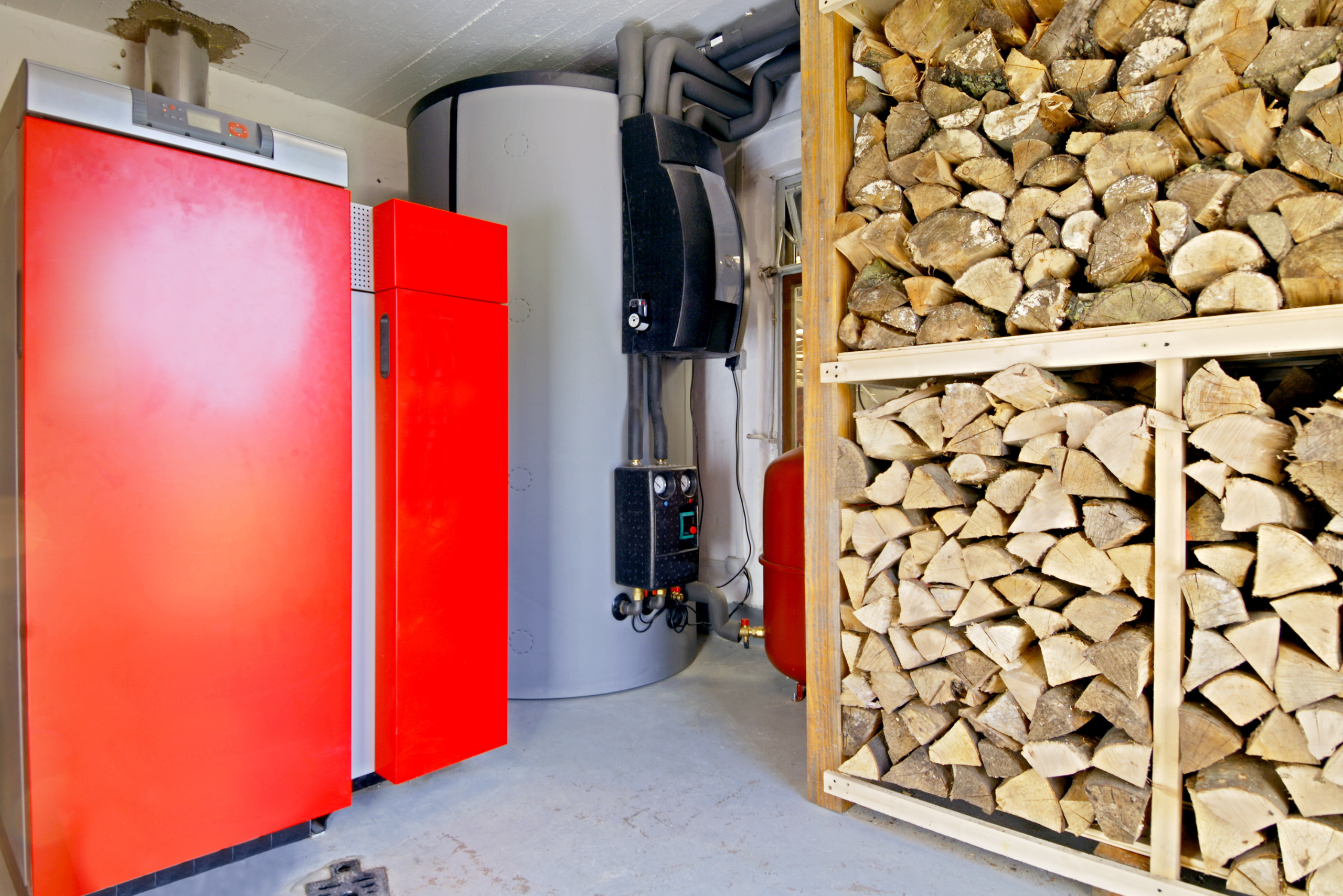 Large DIY firewood rack in the basement of a home.